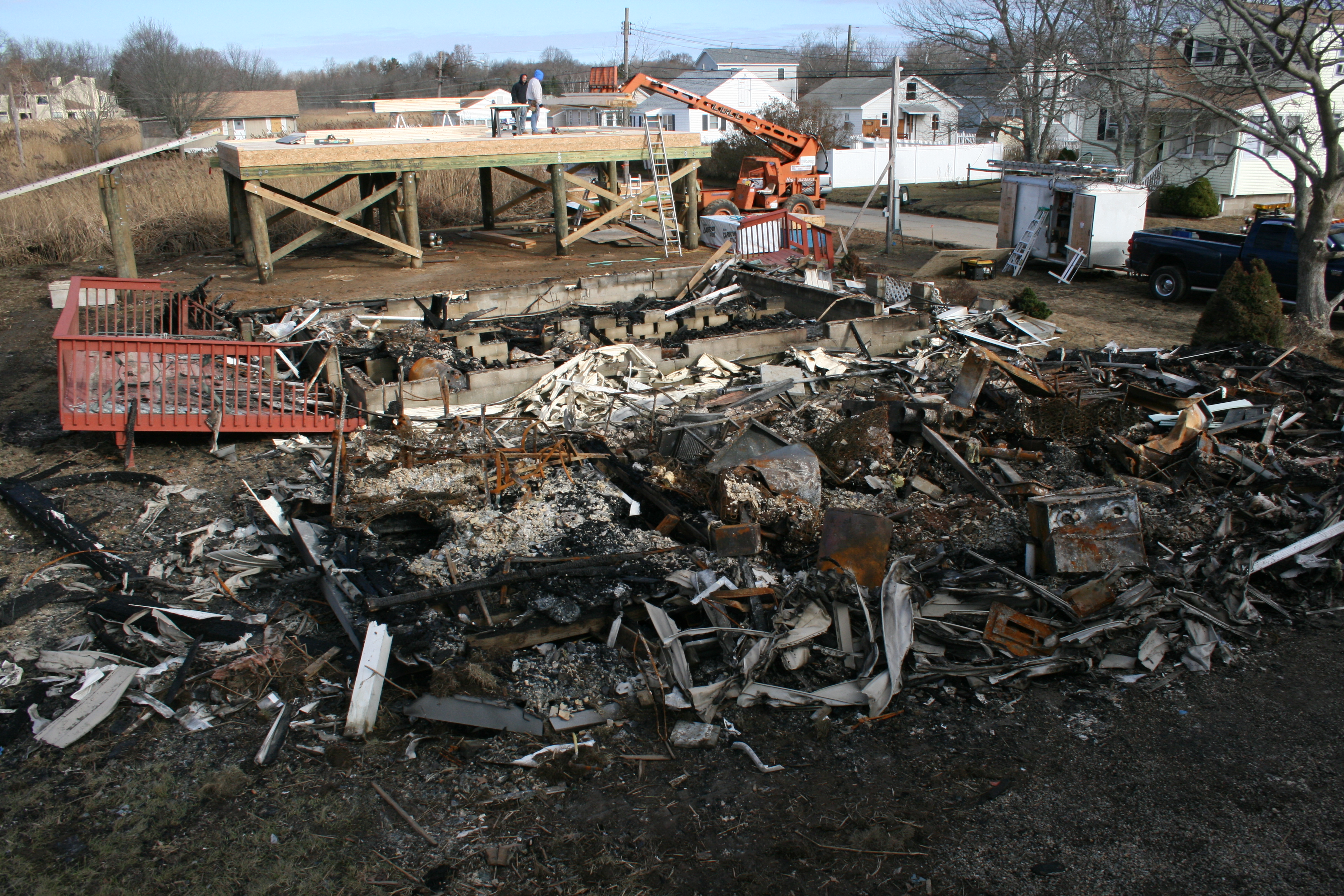 Remains of two Chalker Beach cottages burned to the ground.