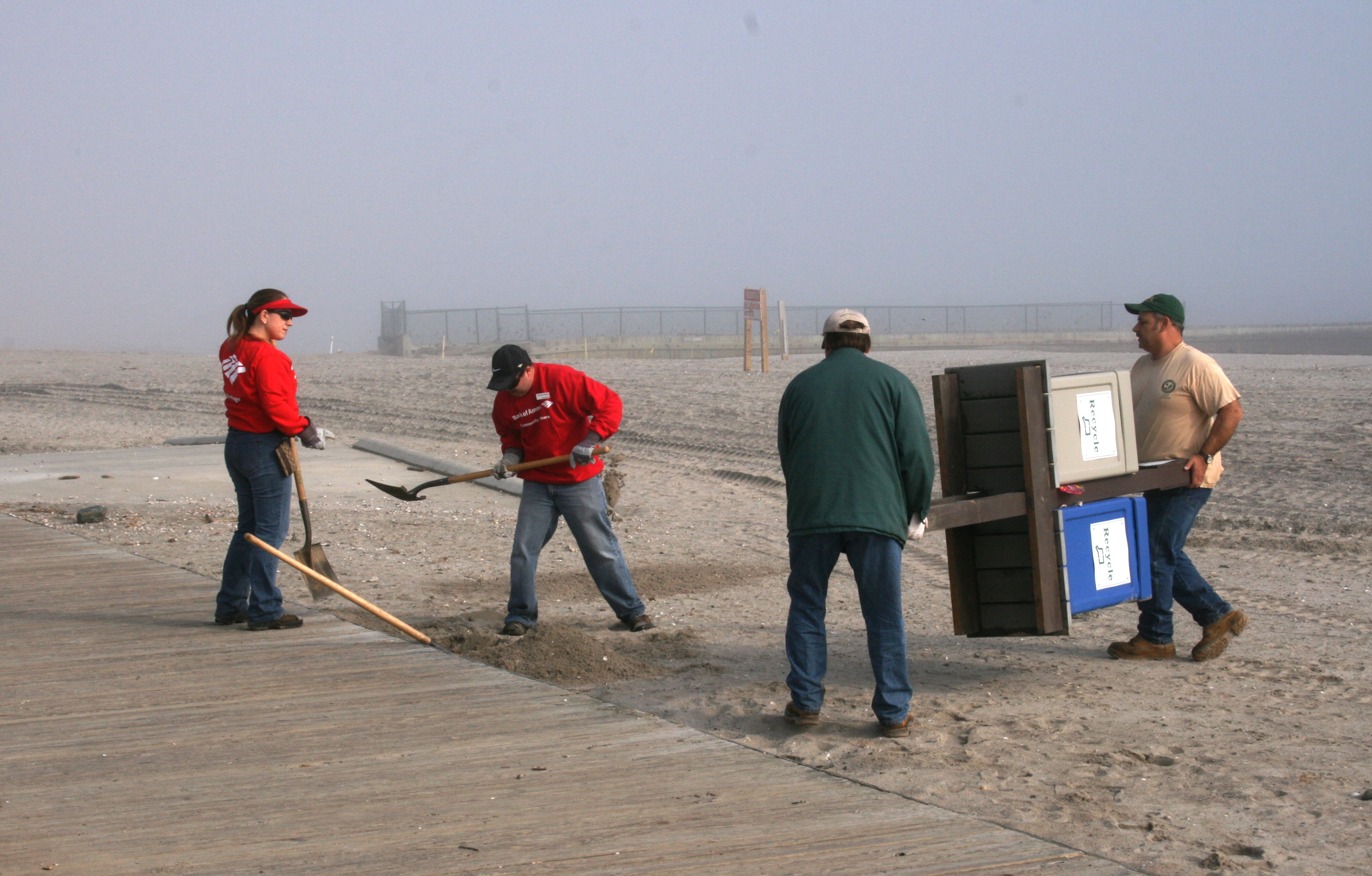 Bank of America volunteers removing debris from Silver Sands after Hurricane Sandy