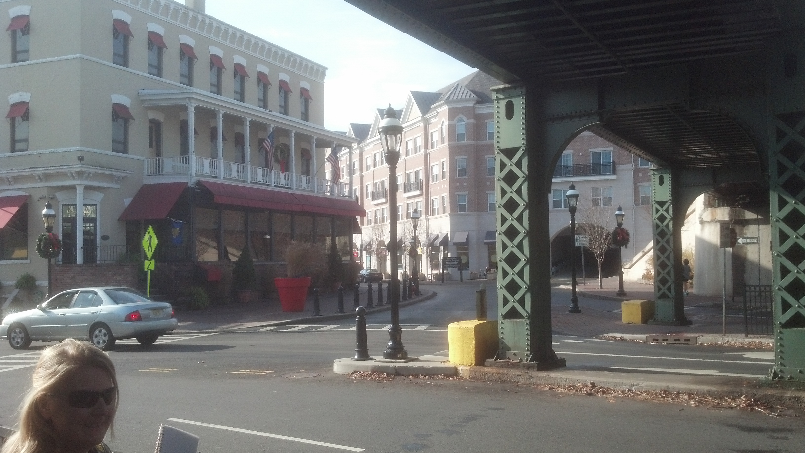Cranford Crossing (far building) is a TOD project with 50 condos, ground retail and a carefully placed parking garage.