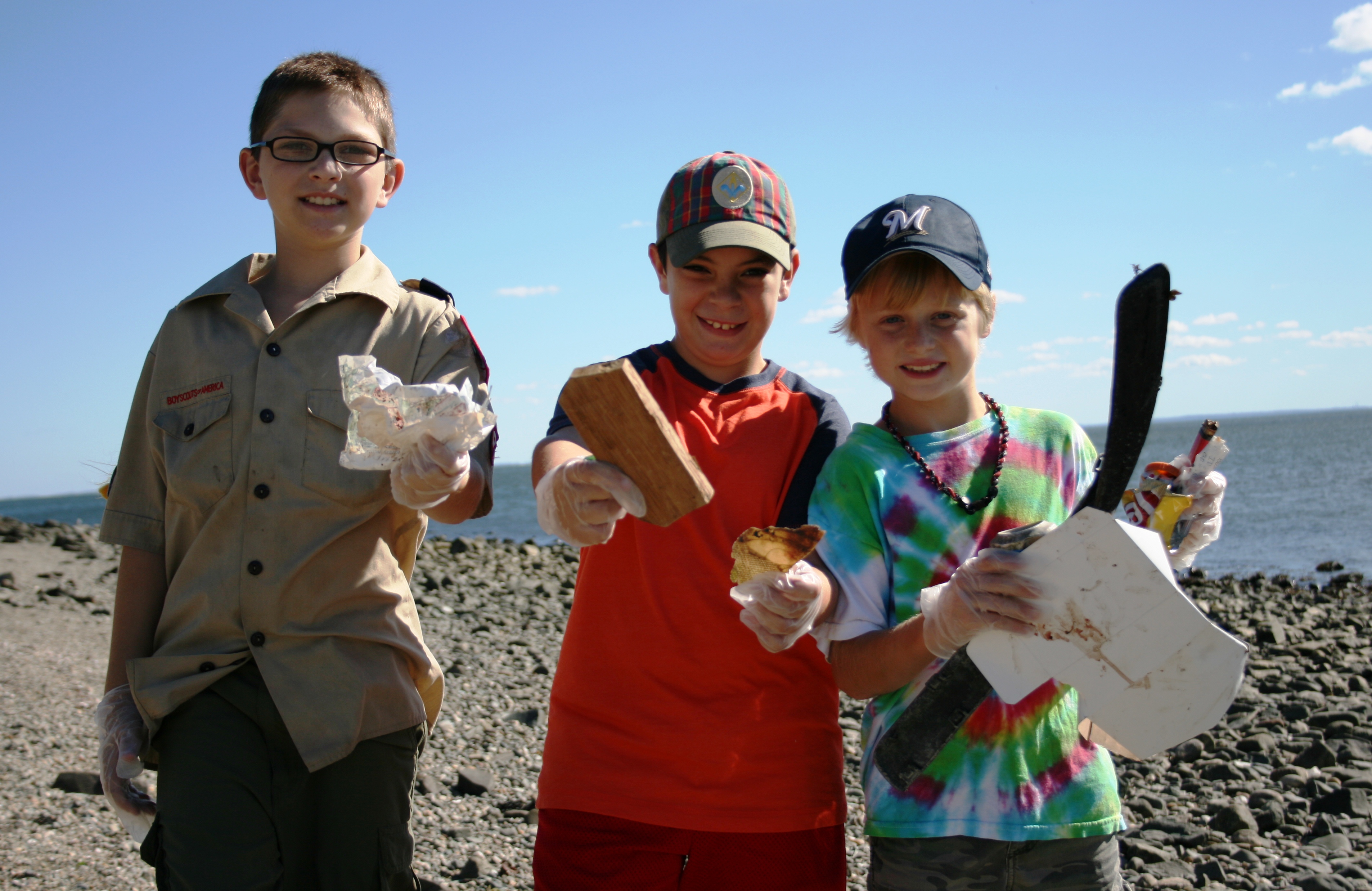 Boy Scouts picking up trash at Gulf Beach in Milford