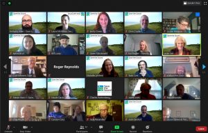 Screenshot of a Zoom meeting with 25 people smiling at the camera